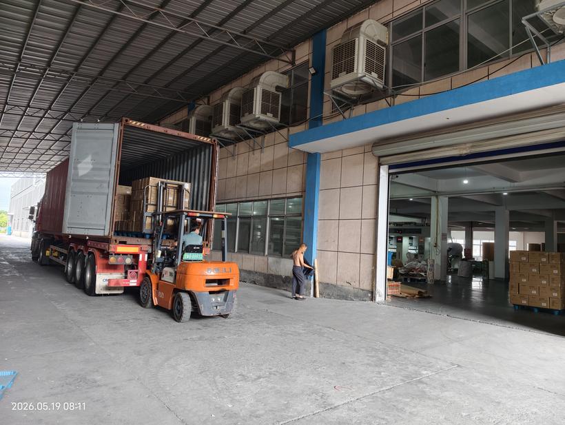 Second forklift loading phase — Kosda paper products export container loading